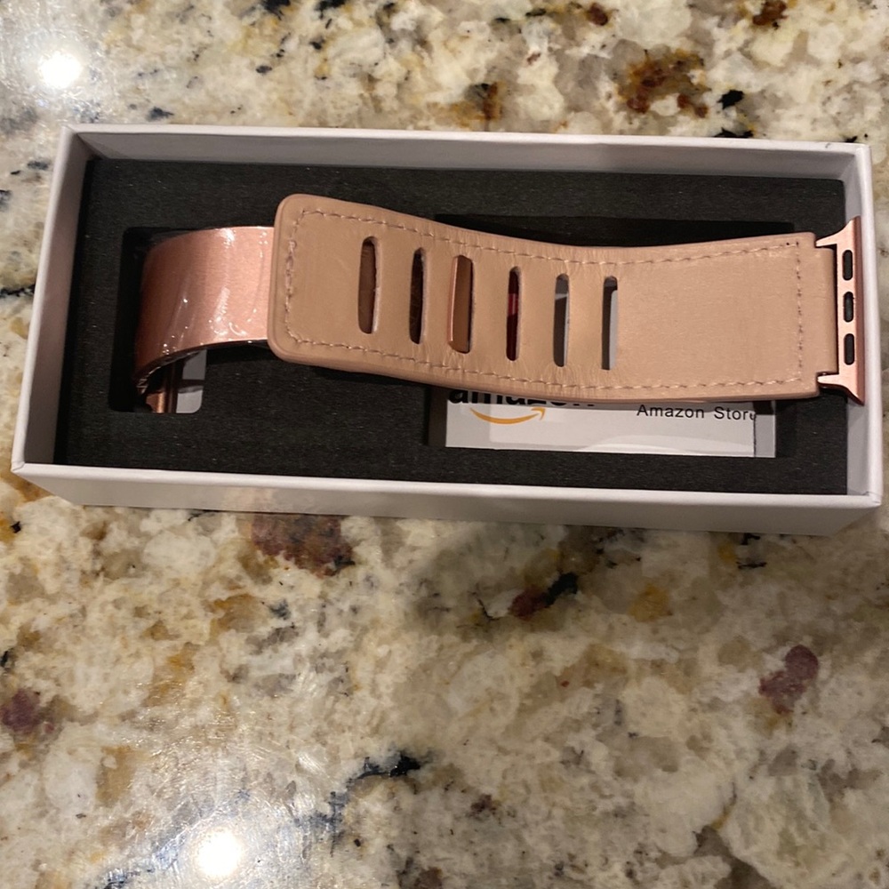 Rose pink Apple Watch band.